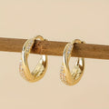 Twisted Gold Hoop Earrings with Pavé Crystal Accents