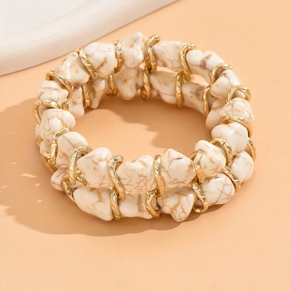 Gewebtes goldenes Armband mit Türkis