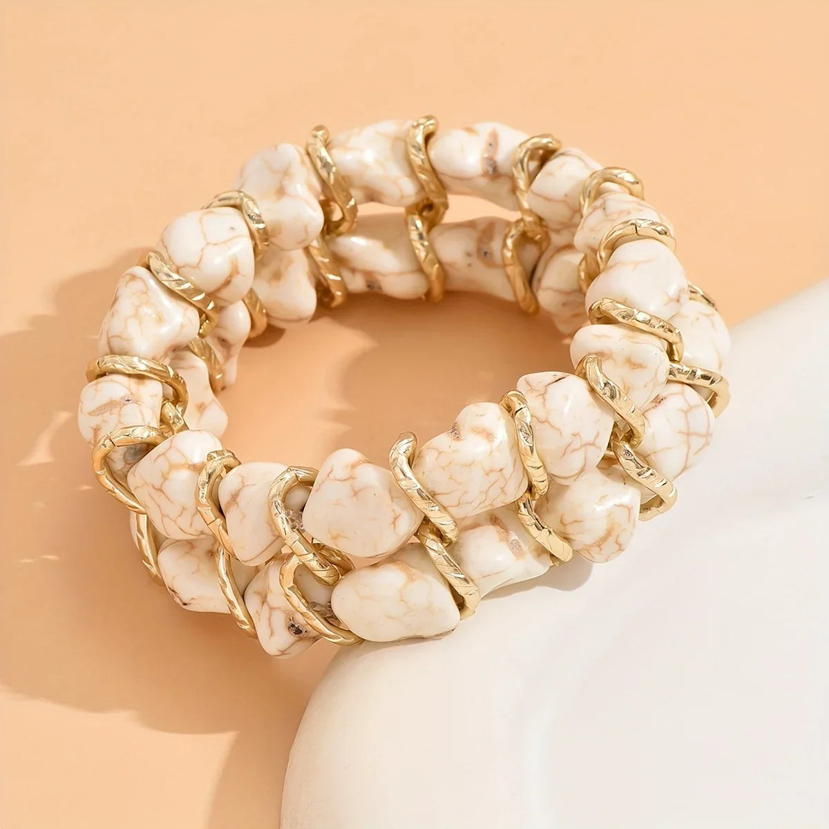 Gewebtes goldenes Armband mit Türkis
