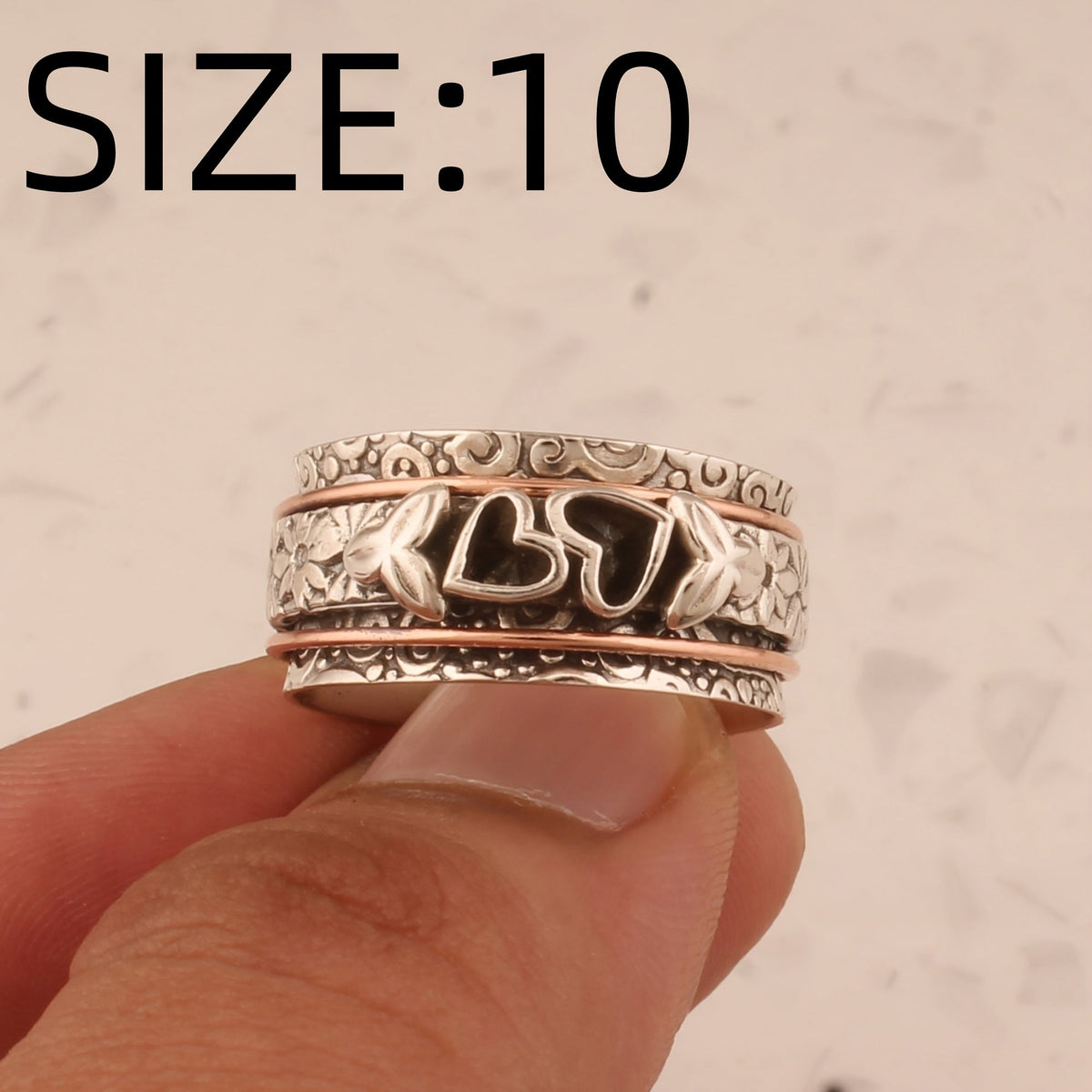 Versilberter Drehring im Vintage-Stil mit Schmetterling und Herz